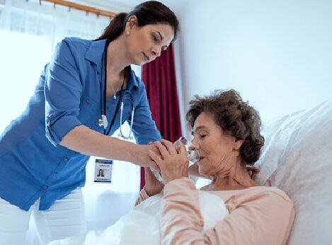 nurse giving patient water